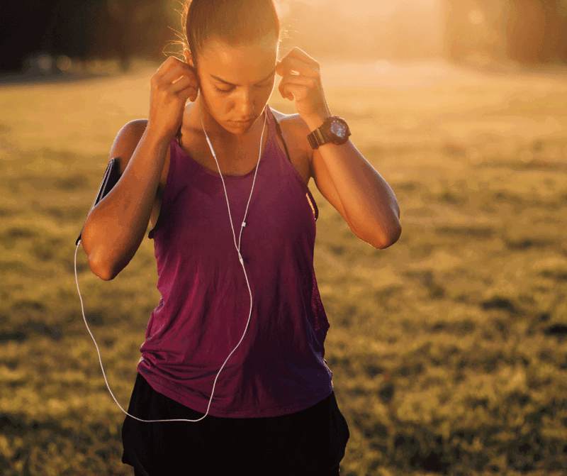 Girl placing headphones on